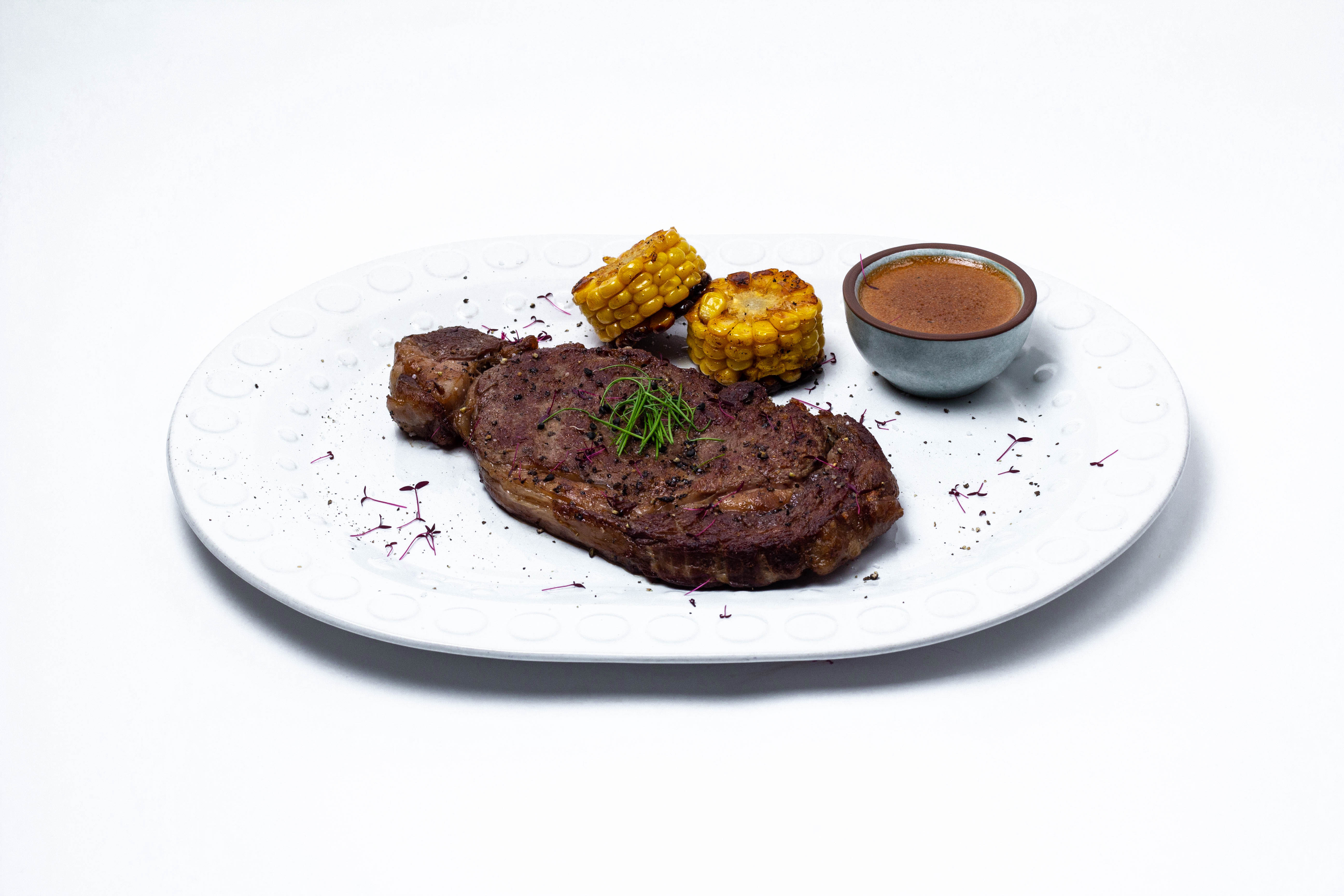 “Miratorg” Rib Eye marbled beef steak with corn and pepper sauce