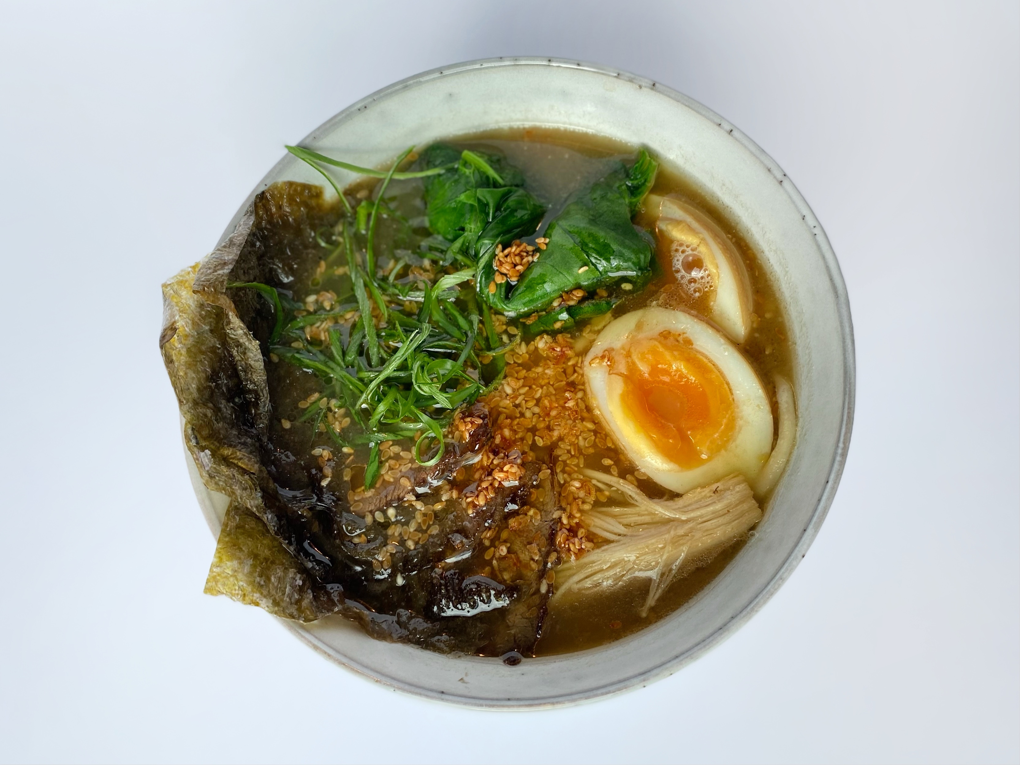 <span color-type="color" style="color: #000000;">Ramen with homemade Dungan noodles with teriyaki roast beef, champignon mushrooms, spinach and pickled egg</span>
