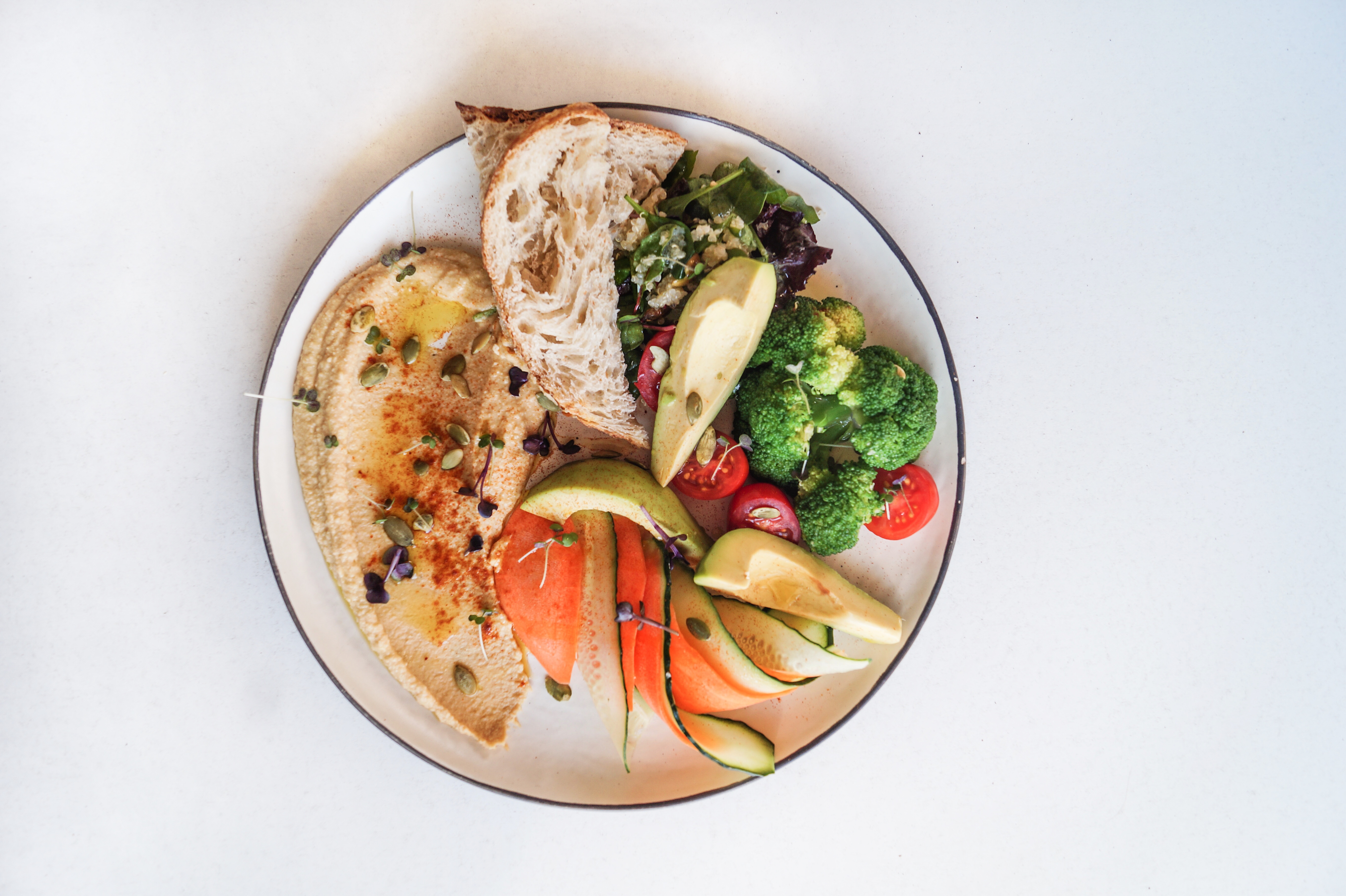 Hummus Bowl with avocado, broccoli, quinoa, cucumber, carrot and mixed salad