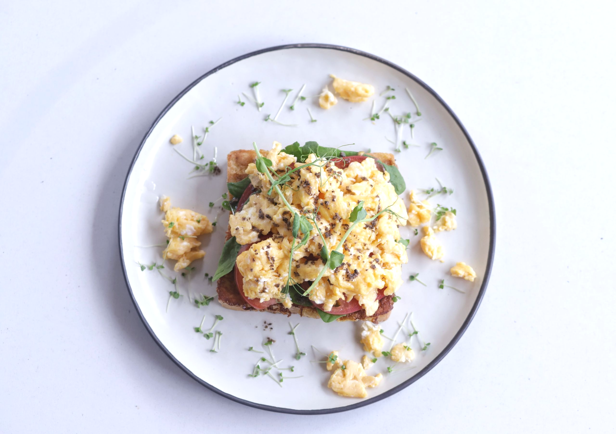 <span style="color: #fc0000;">NEW!</span> Brioche with truffled scrambled eggs, pink tomatoes and spinach